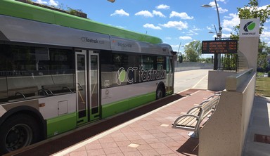 Green CTFastrack Bus Stopped at Station
