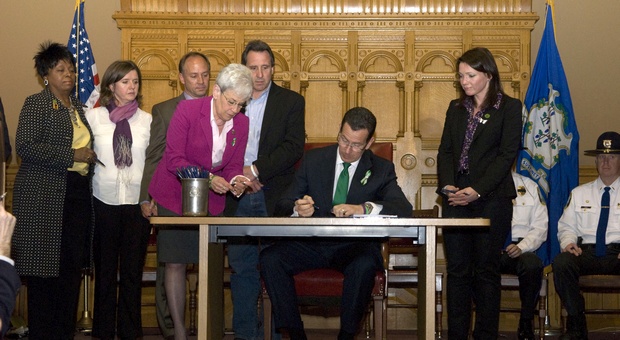 Governor Malloy signs into law a comprehensive bill on gun violence prevention, mental health initiatives, and school safety policies