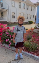 Rodney's son wearing his backpack