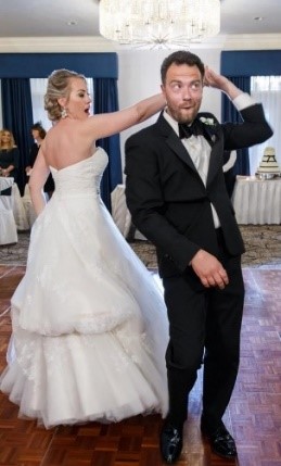 Rebecca spins Andrew during a dance at their wedding