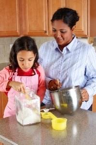 Woman and girl cooking